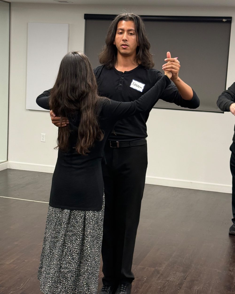 An instructor dancing with a student during a class at the Pozez JCC
